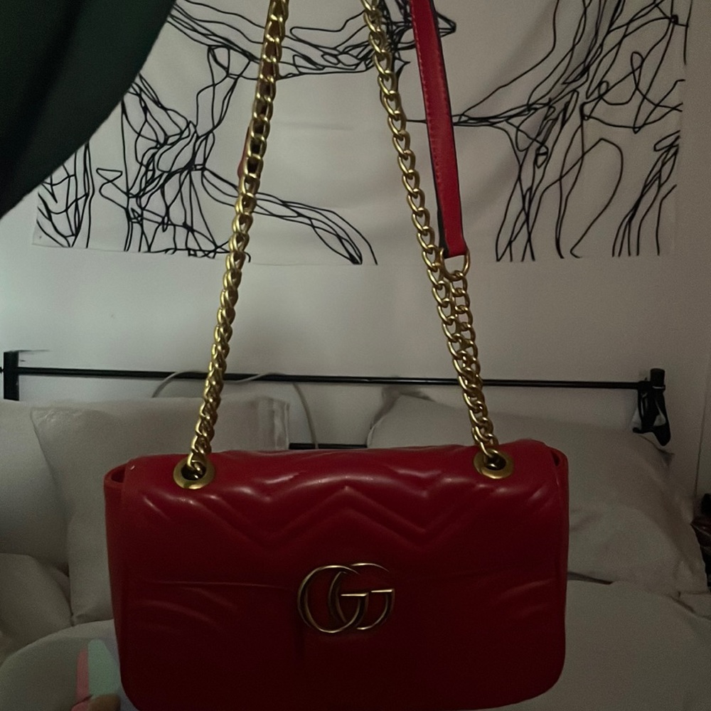 GG Marmont small matelassé shoulder bag in hibiscus red leather.